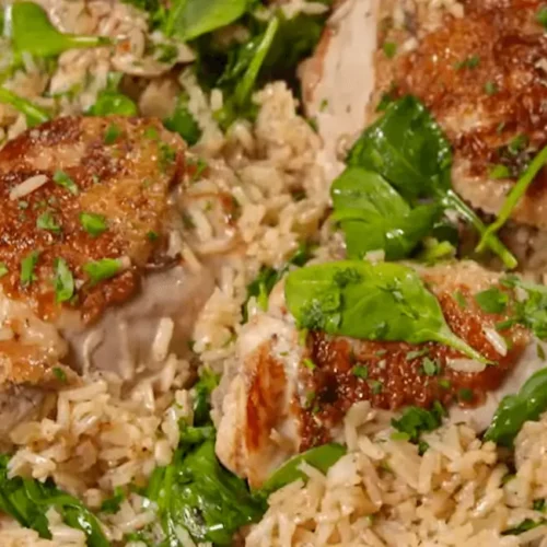 Close-up of Ranch Chicken and Rice with tender chicken, rice, and spinach in a pan.