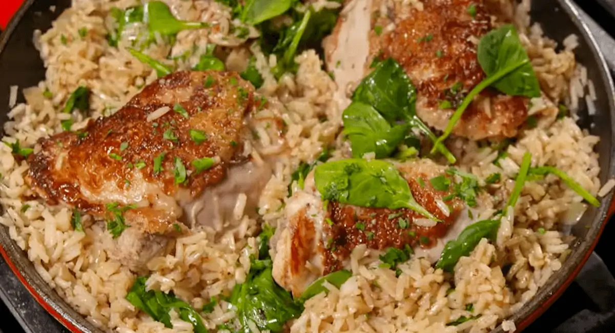 Close-up of Ranch Chicken and Rice with tender chicken, rice, and spinach in a pan.