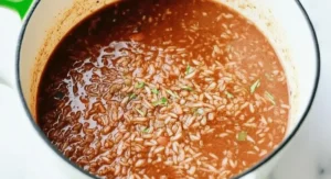 Close-up of simmering Mexican Brown Rice in a pot.