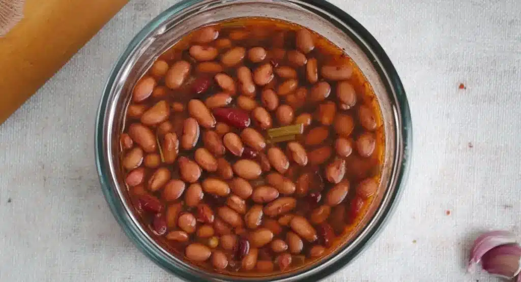 Kashmiri Rajma Curry Recipe – Authentic, Aromatic, and Soul-Warming 15 Kidney beans soaking in liquid, part of the Kashmiri Rajma Curry Recipe preparation.