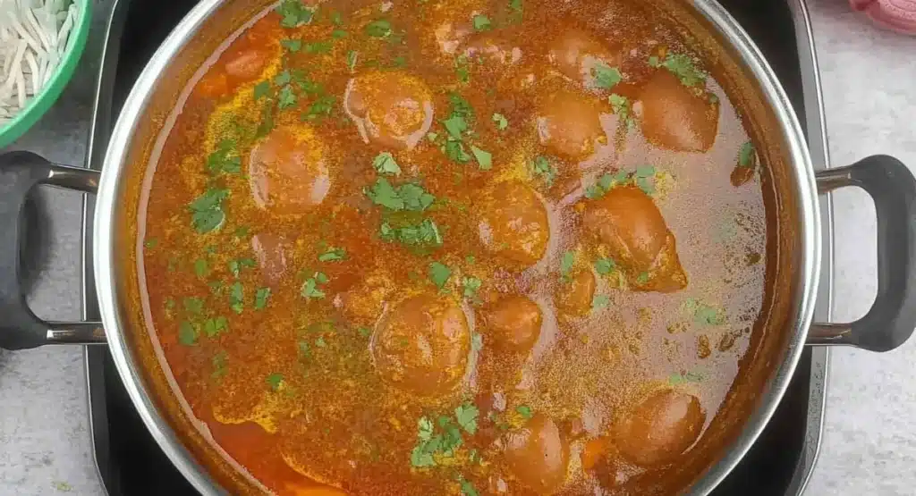 Kashmiri Rajma Curry Recipe – Authentic, Aromatic, and Soul-Warming 17 A pot of simmering Kashmiri Rajma Curry Recipe with visible spices and herbs.