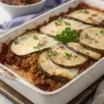 Greek Eggplant Moussaka Recipe: Ultimate 5-Layer Delight 9 Golden Greek Eggplant Moussaka Recipe in a baking dish, topped with creamy béchamel and fresh parsley.